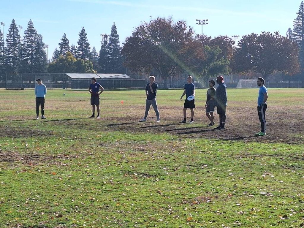 Saturday Morning ultimate Frisbee game in Fresno. mixed team on a line